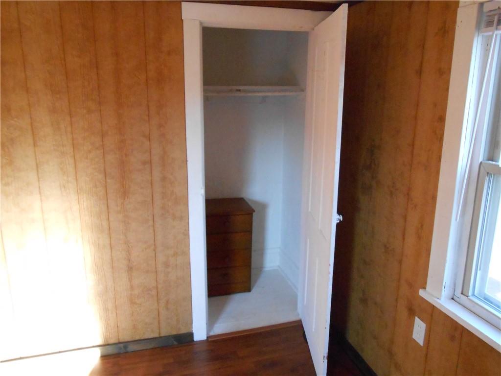 516 Oneida Street Monessen, PA 15062 - Photo 28 of 36 a view of a hallway with wooden floor