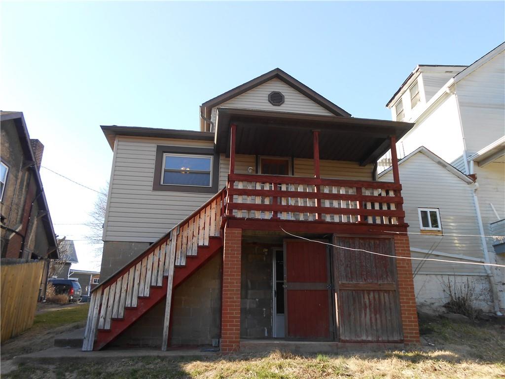 516 Oneida Street Monessen, PA 15062 - Photo 35 of 36 a front view of house with wooden fence