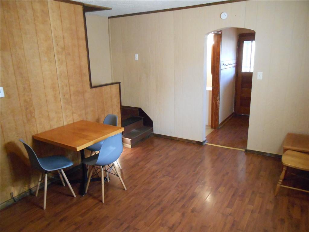 516 Oneida Street Monessen, PA 15062 - Photo 8 of 36 a view of a room with furniture and wooden floor
