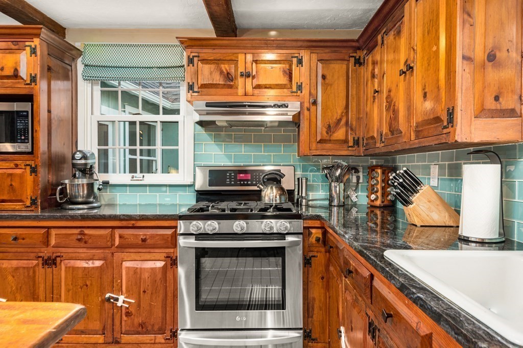 375 Ipswich Road Boxford, MA 01921 - Photo 6 of 42 a kitchen with stainless steel appliances granite countertop a stove and a sink