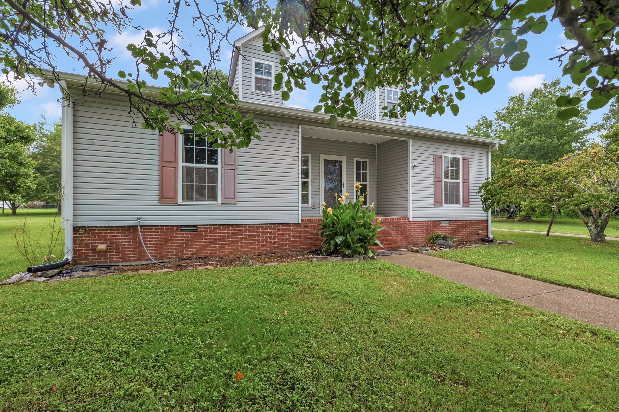 876 Monument Road Summertown, TN 38483 - Photo 5 of 26 a front view of house with yard and green space