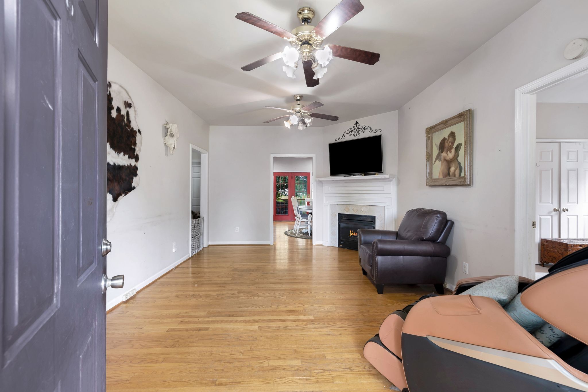 876 Monument Road Summertown, TN 38483 - Photo 7 of 26 a living room with furniture fireplace and a flat screen tv