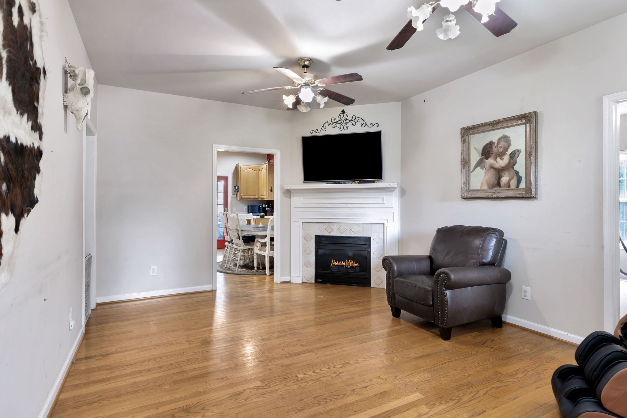 876 Monument Road Summertown, TN 38483 - Photo 8 of 26 a living room with furniture a flat screen tv and a fireplace