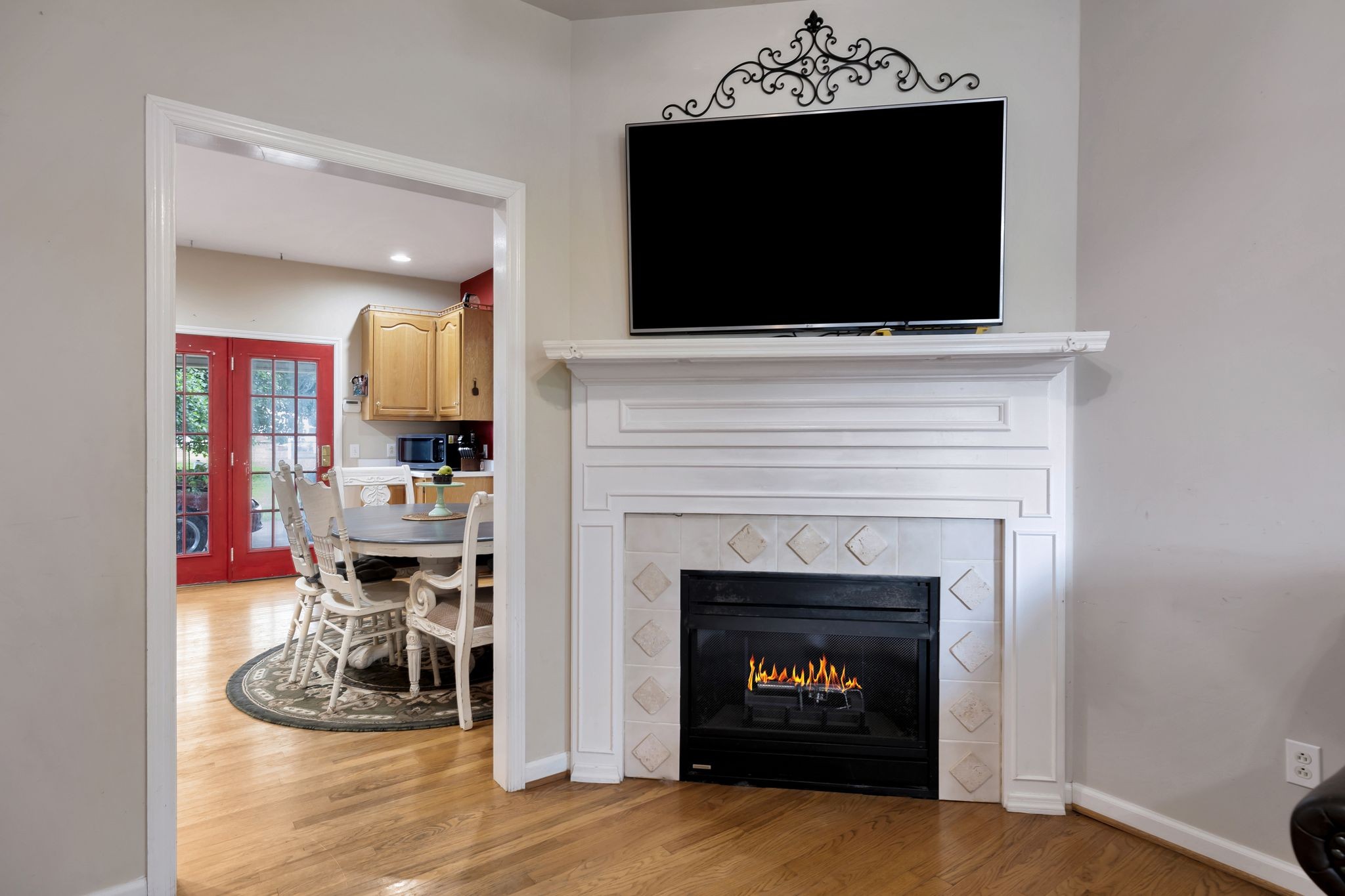 876 Monument Road Summertown, TN 38483 - Photo 10 of 26 a living room with a fireplace a flat screen tv and a fireplace