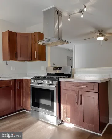 a kitchen with a stove and a sink