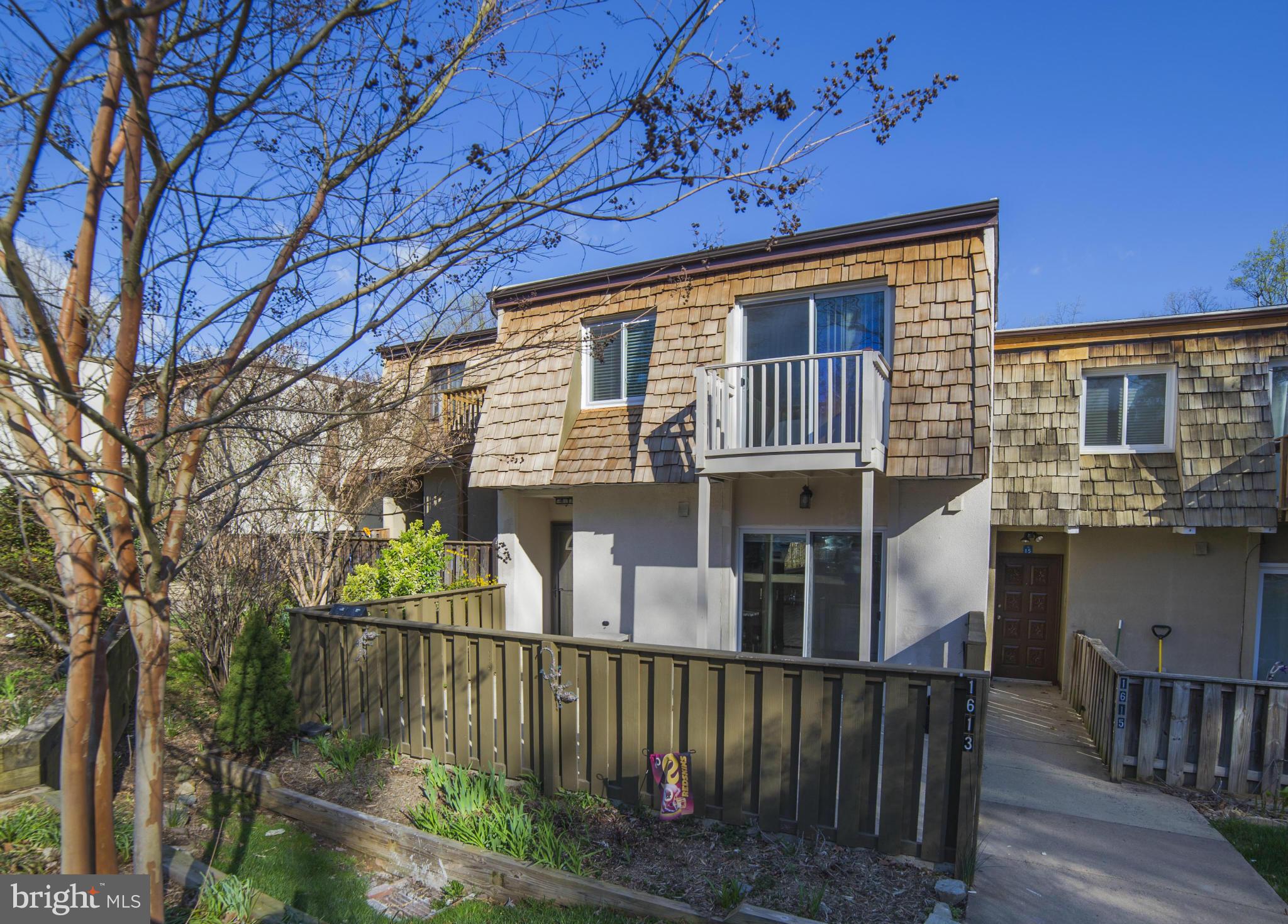 1613 Valencia Way Reston, VA 20190 - Photo 1 of 29 a front view of a house with balcony