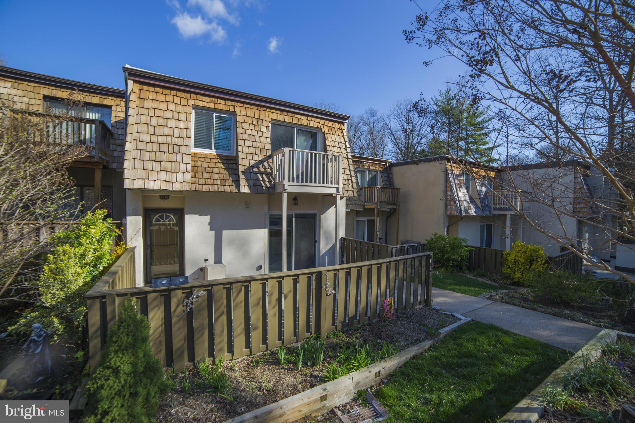 1613 Valencia Way Reston, VA 20190 - Photo 2 of 29 a view of a house with brick walls