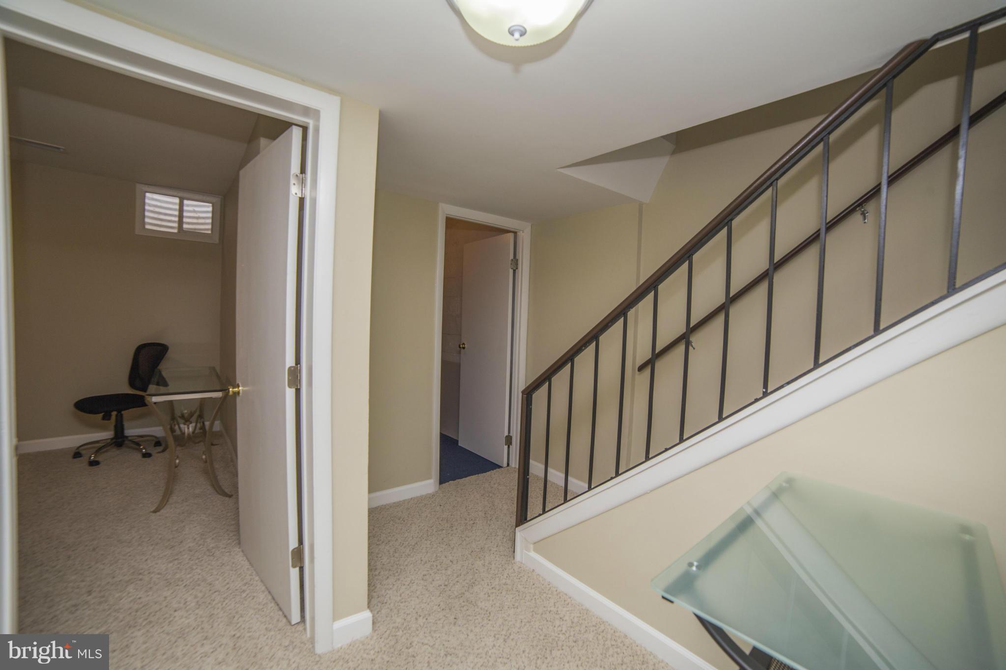1613 Valencia Way Reston, VA 20190 - Photo 20 of 29 a view of a hallway with dining room and stairs