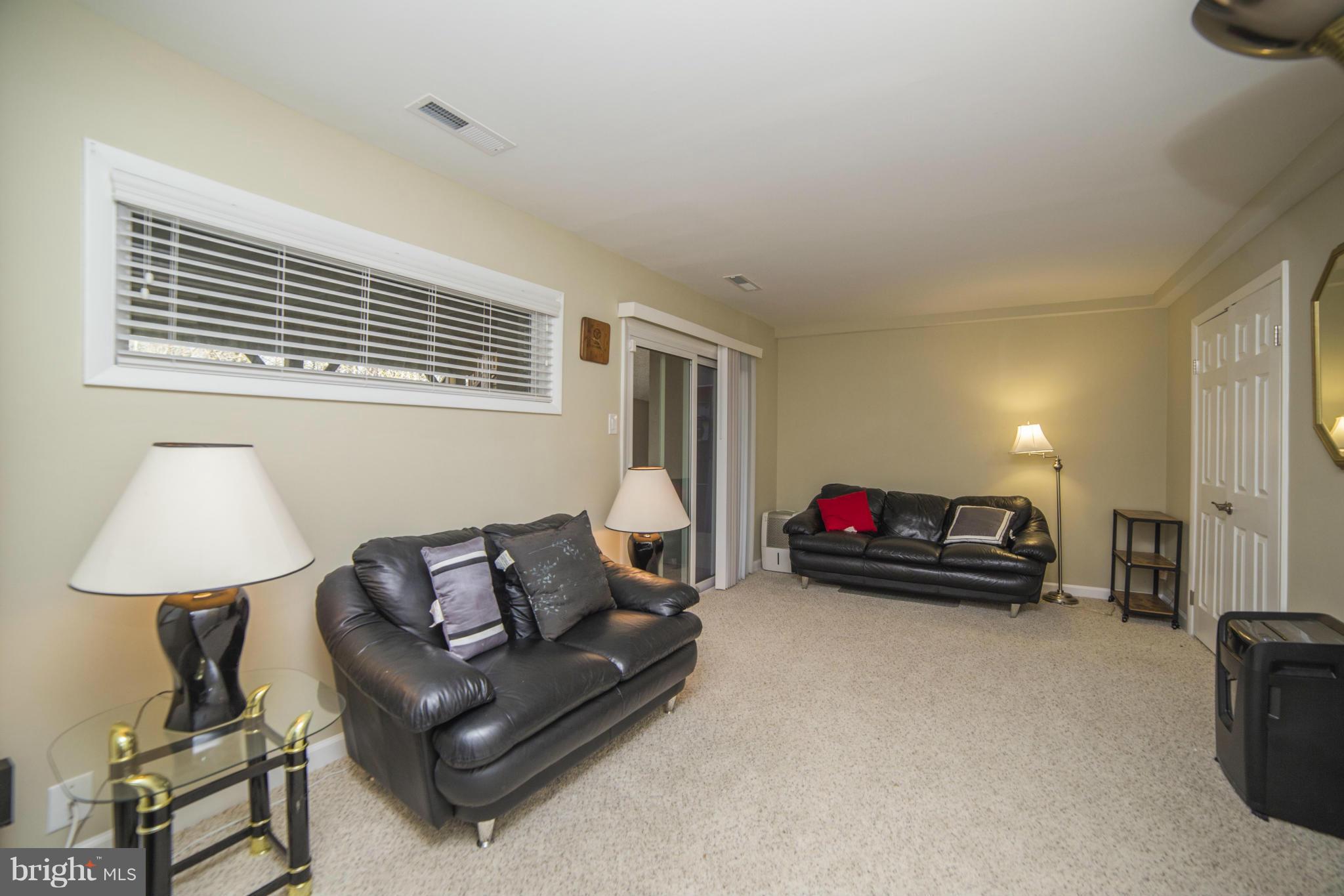 1613 Valencia Way Reston, VA 20190 - Photo 24 of 29 a living room with furniture and a window