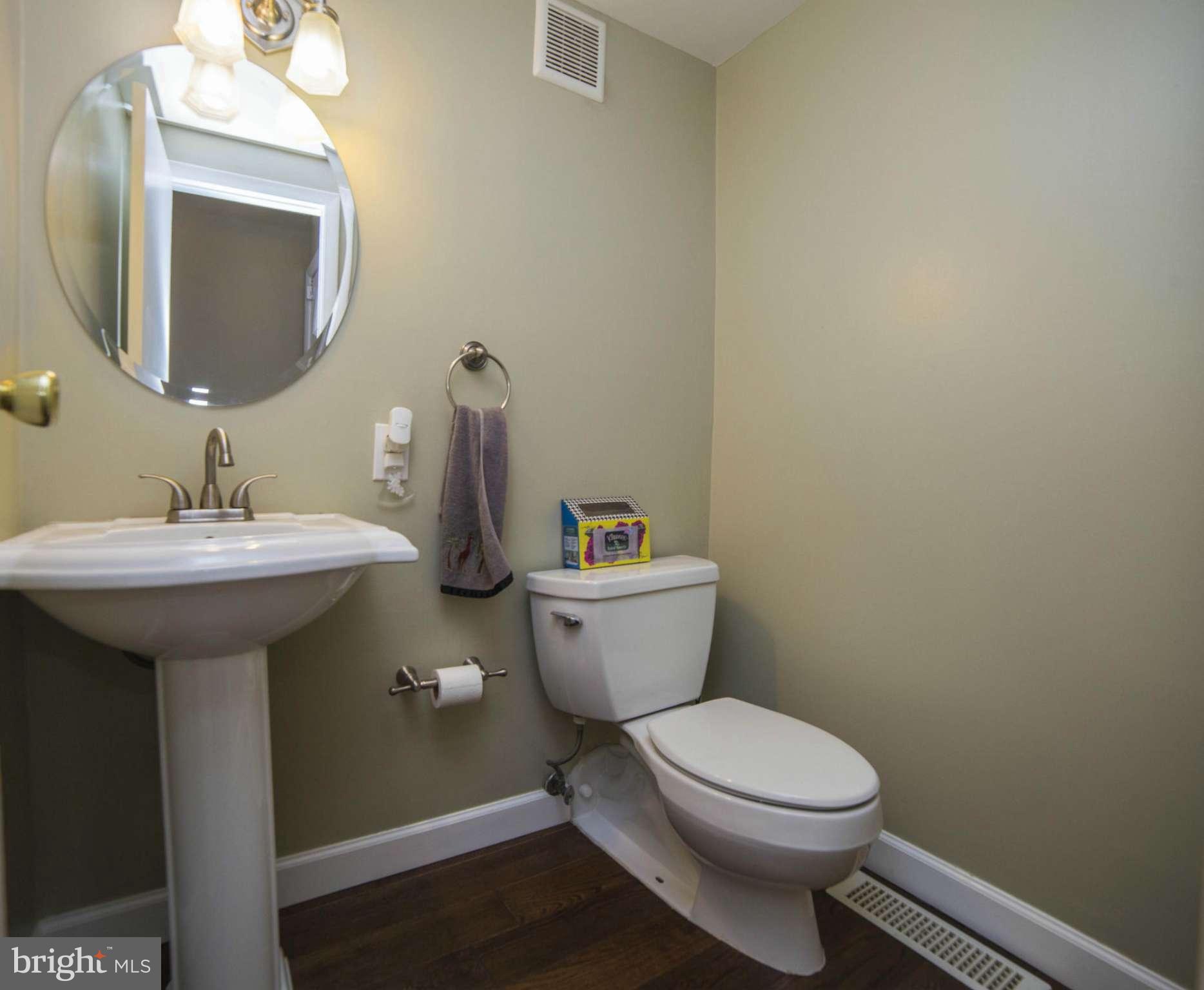 1613 Valencia Way Reston, VA 20190 - Photo 9 of 29 a bathroom with a toilet sink and mirror