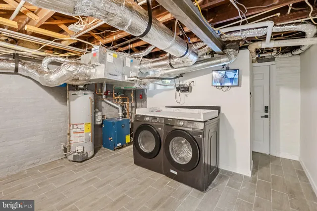a utility room with dryer and washer