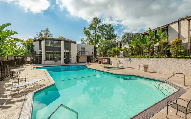 an aerial view of residential building and parking space
