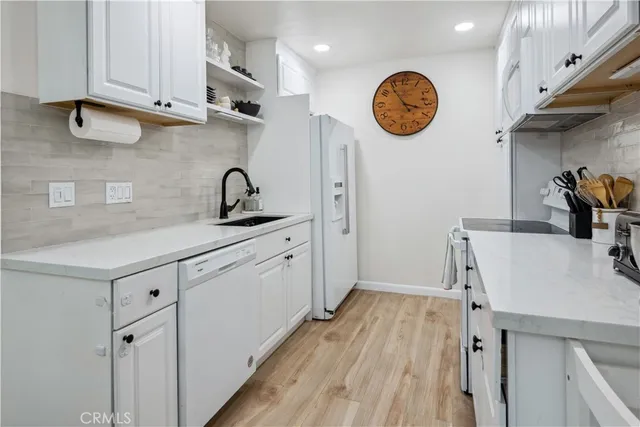 a view of a kitchen with cabinets