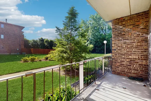 a view of a balcony with an outdoor space