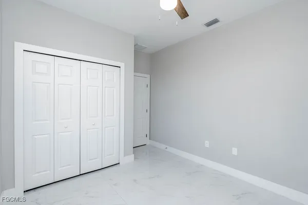 a view of a small space with wooden floor