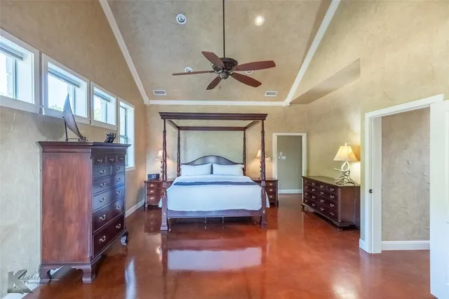 a bedroom with bed and window