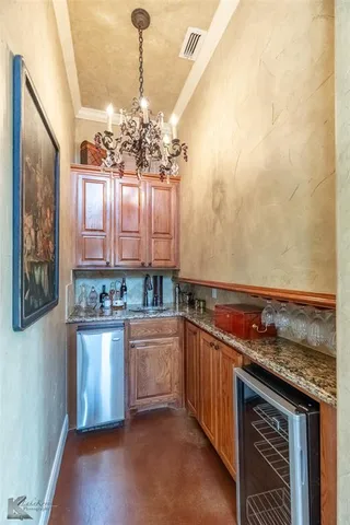 a kitchen with stainless steel appliances granite countertop a stove and a sink