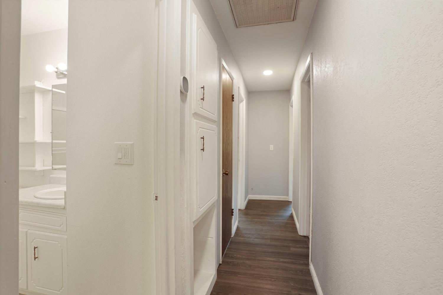 2443 Fern Street Merced, CA 95348 - Photo 16 of 50 a view of hallway with wooden floor