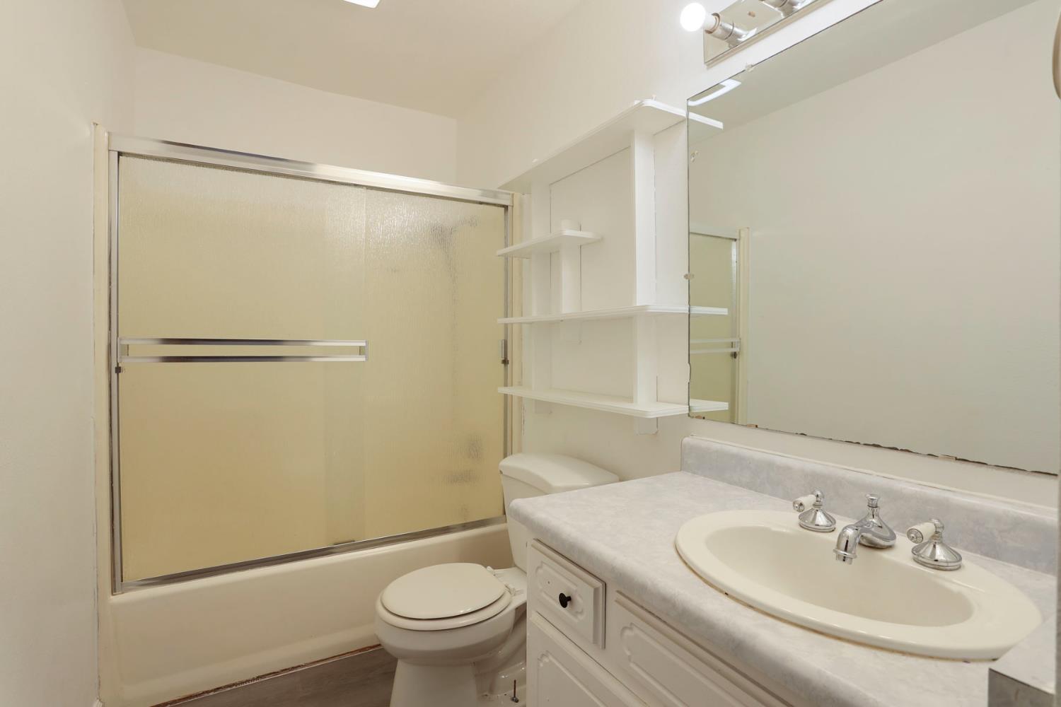 2443 Fern Street Merced, CA 95348 - Photo 17 of 50 a bathroom with a sink toilet and shower