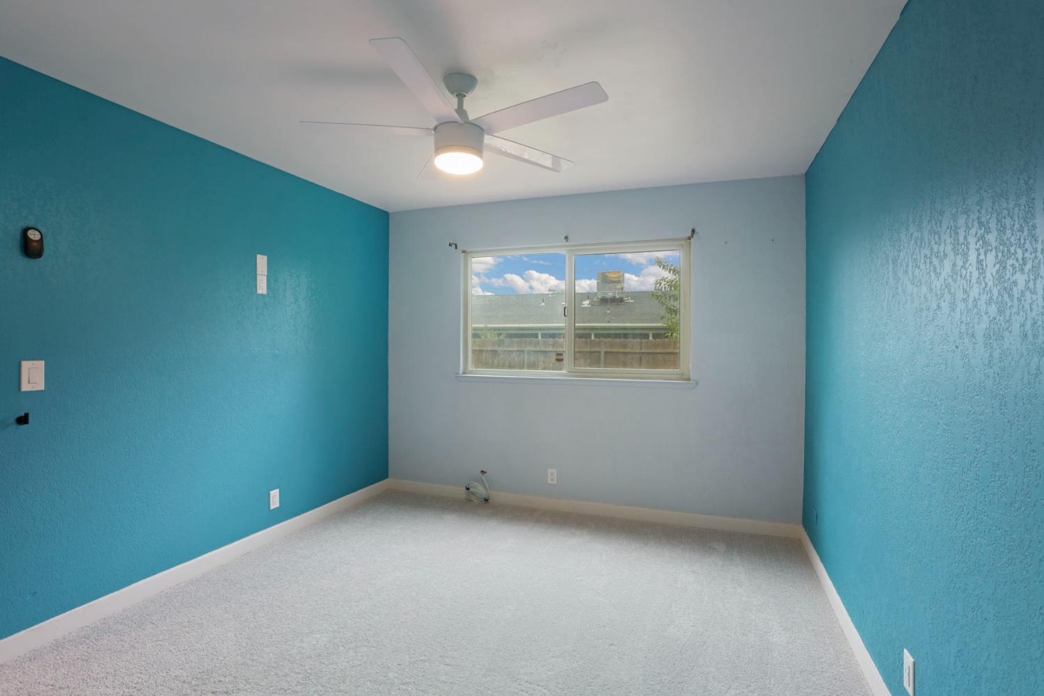 2443 Fern Street Merced, CA 95348 - Photo 20 of 50 an empty room with a window