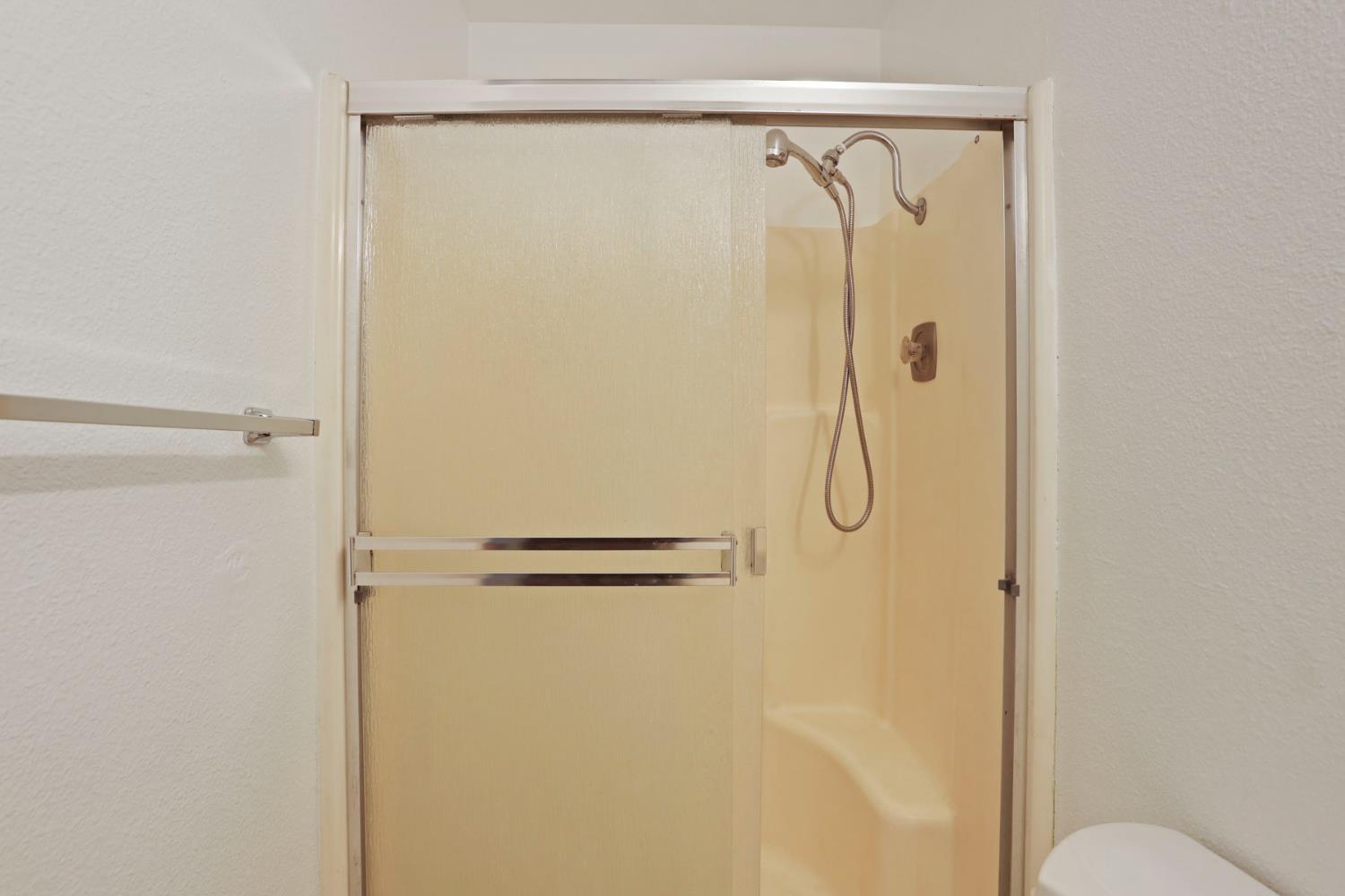 2443 Fern Street Merced, CA 95348 - Photo 26 of 50 a bathroom with a shower