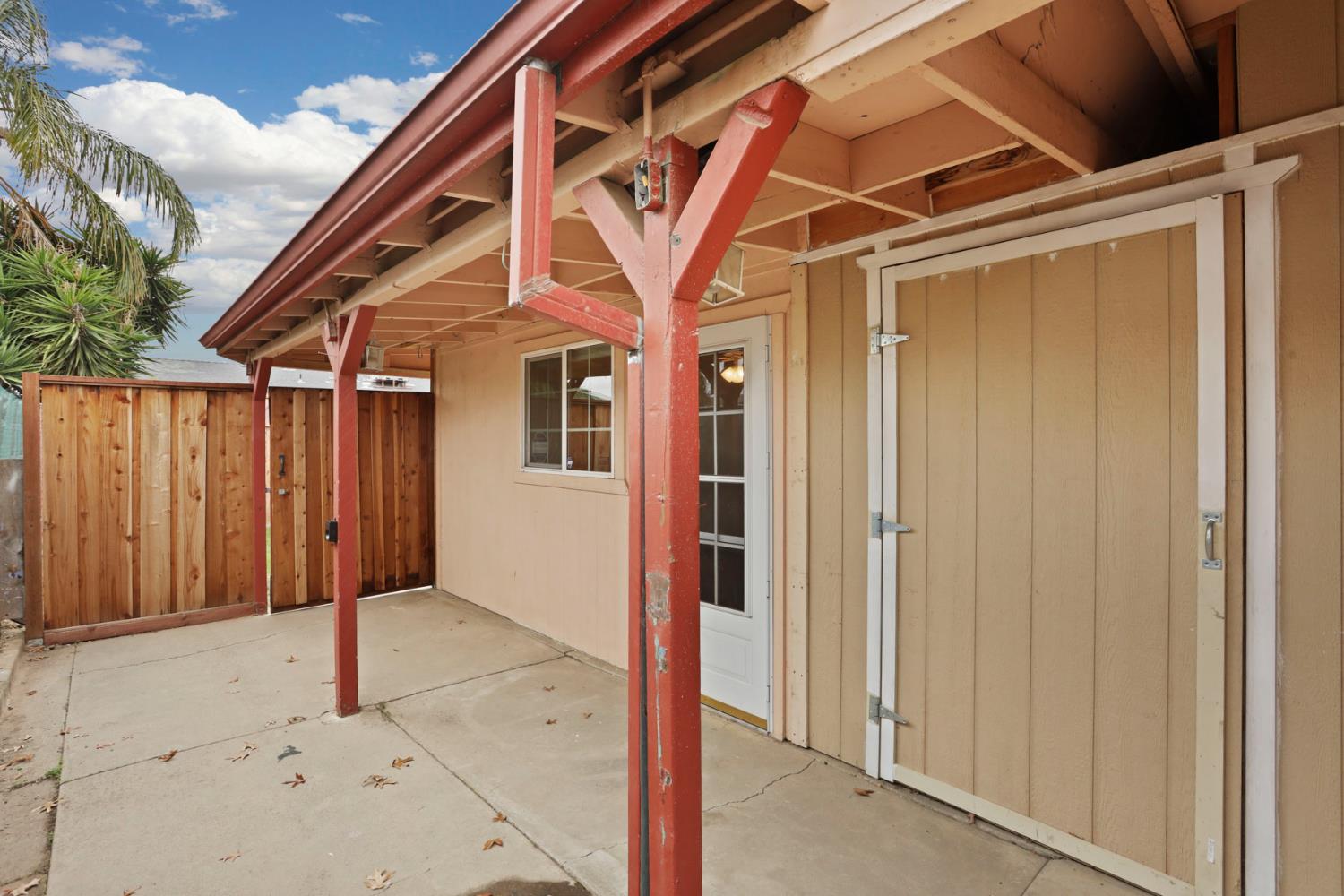 2443 Fern Street Merced, CA 95348 - Photo 30 of 50 a view of a house with a wooden door