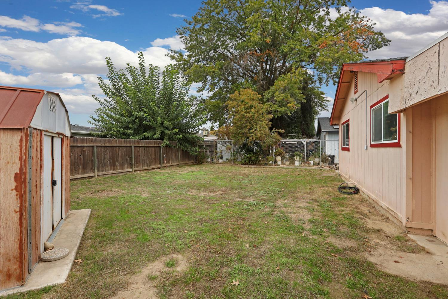 2443 Fern Street Merced, CA 95348 - Photo 32 of 50 a view of a yard with a house