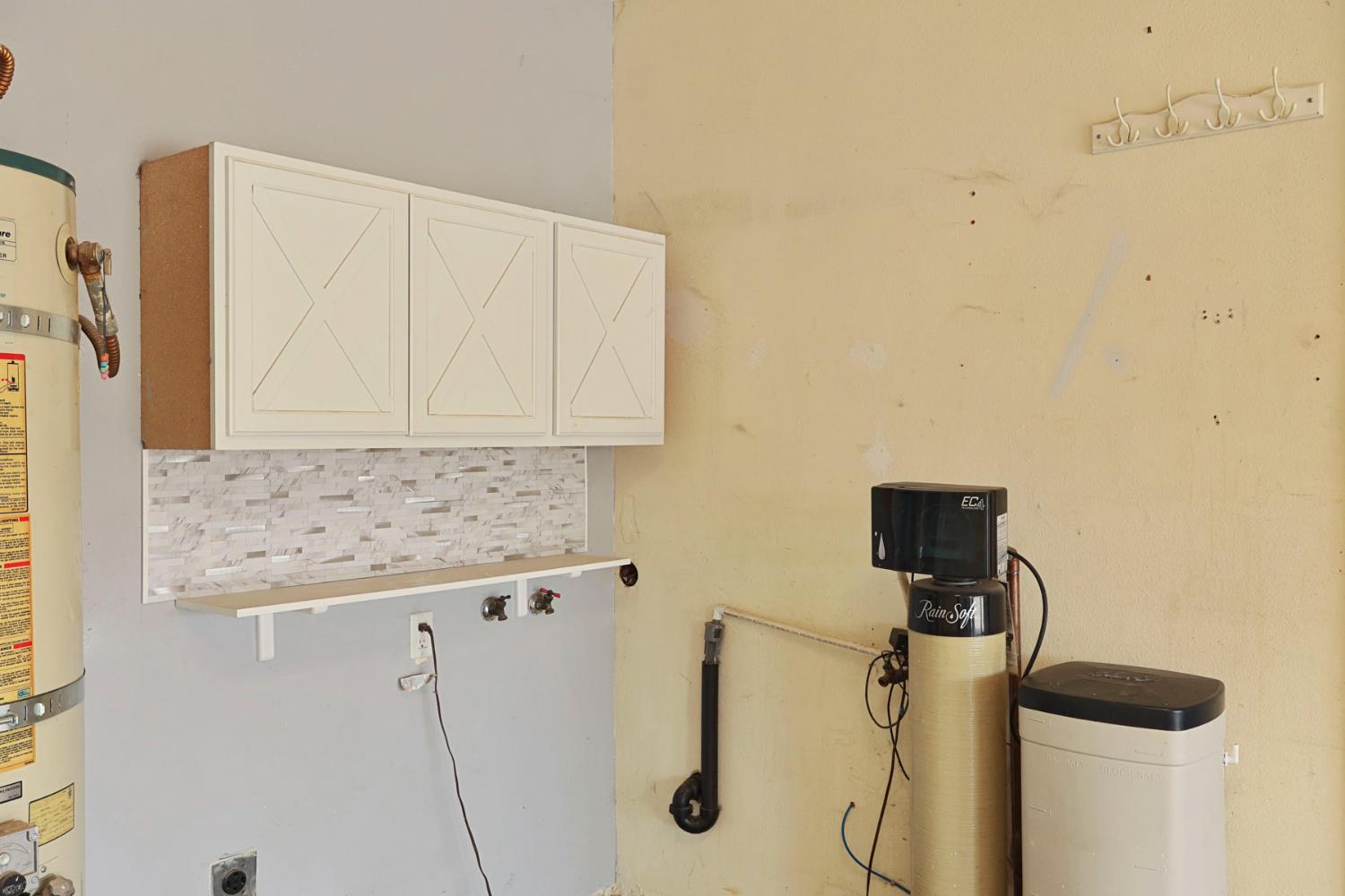 2443 Fern Street Merced, CA 95348 - Photo 39 of 50 a bathroom with a granite countertop sink and a mirror