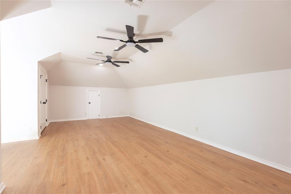 2020 Arbor Bend Road Bonham, TX 75418 - Photo 26 of 40 Additional living space featuring light wood finished floors, lofted ceiling, and a ceiling fan