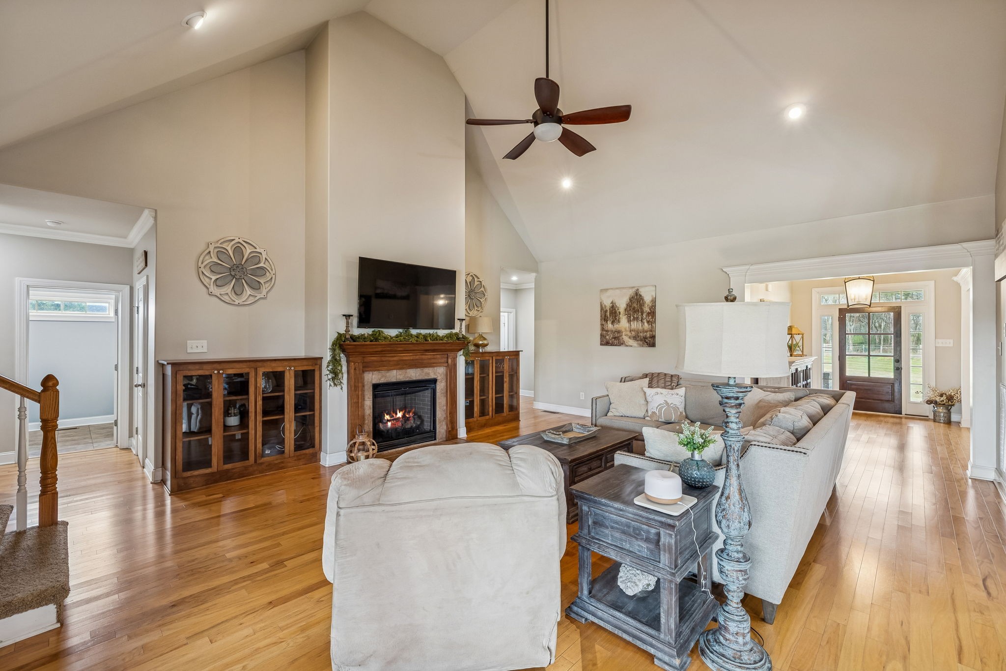 2845 Anes Station Road Lewisburg, TN 37091 - Photo 14 of 70 a living room with furniture a flat screen tv and a fireplace