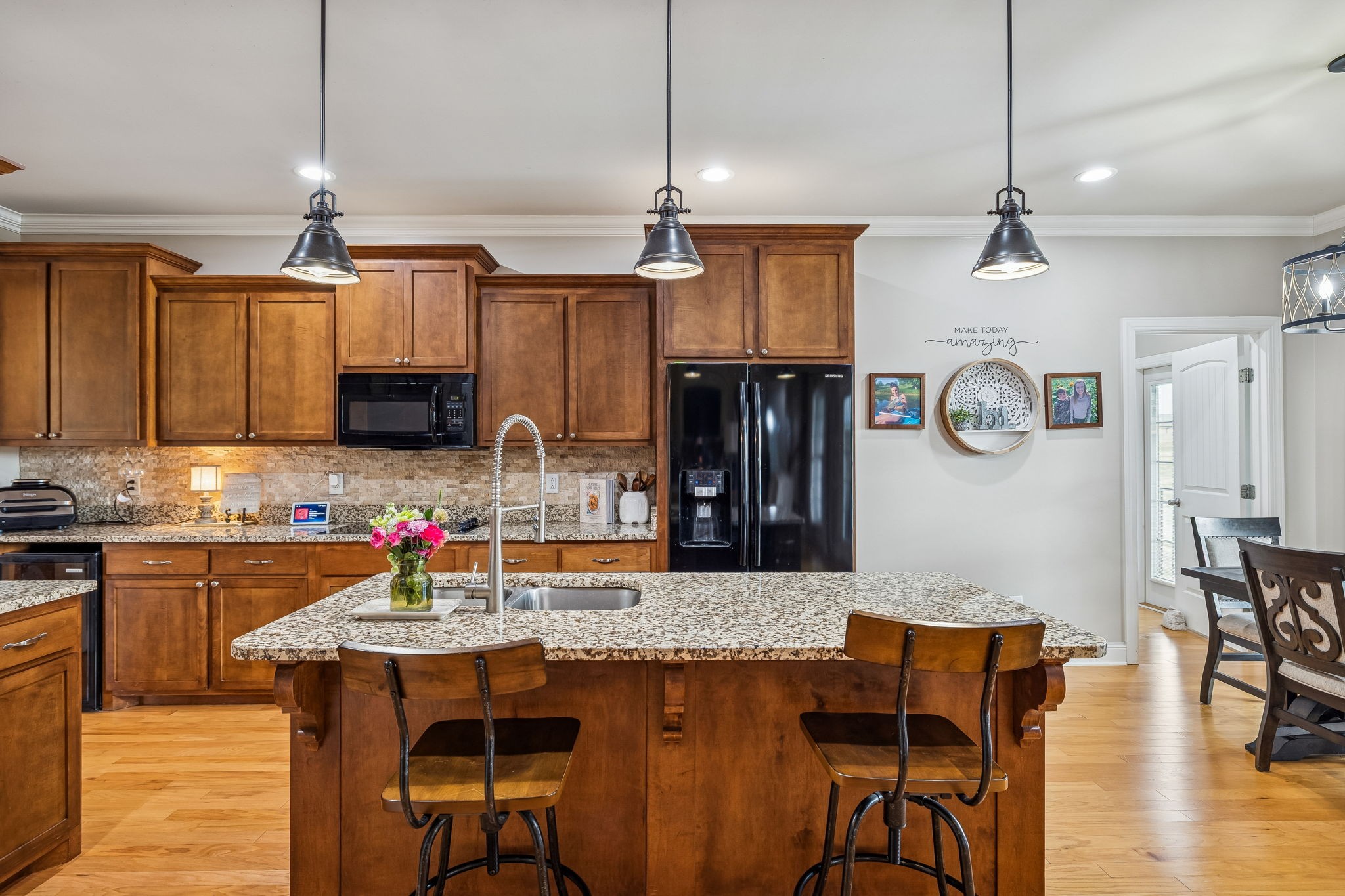 2845 Anes Station Road Lewisburg, TN 37091 - Photo 19 of 70 a kitchen with stainless steel appliances granite countertop a kitchen island a stove a table and chairs