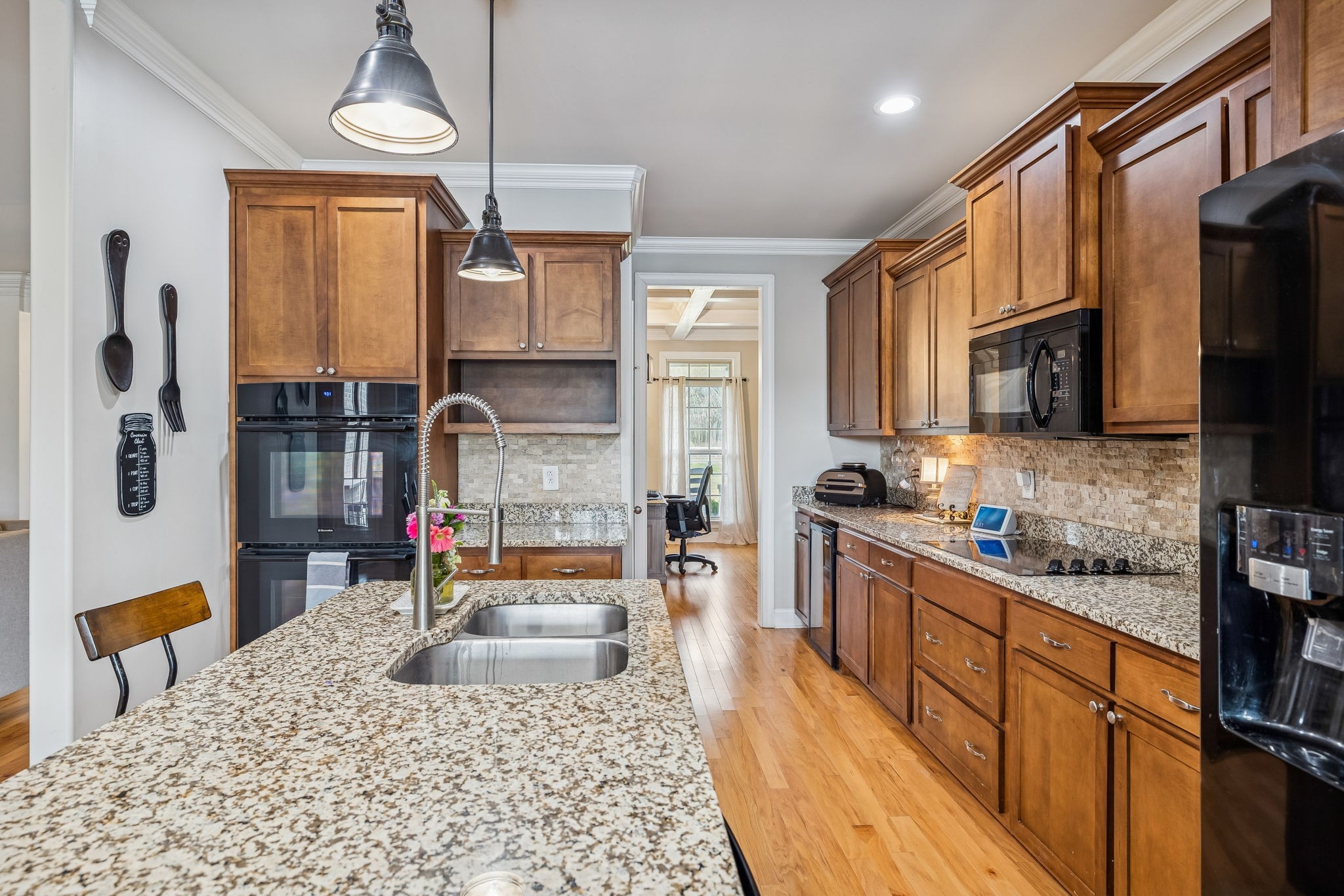 2845 Anes Station Road Lewisburg, TN 37091 - Photo 22 of 70 a kitchen with stainless steel appliances granite countertop a refrigerator a stove top oven a sink dishwasher and wooden cabinets