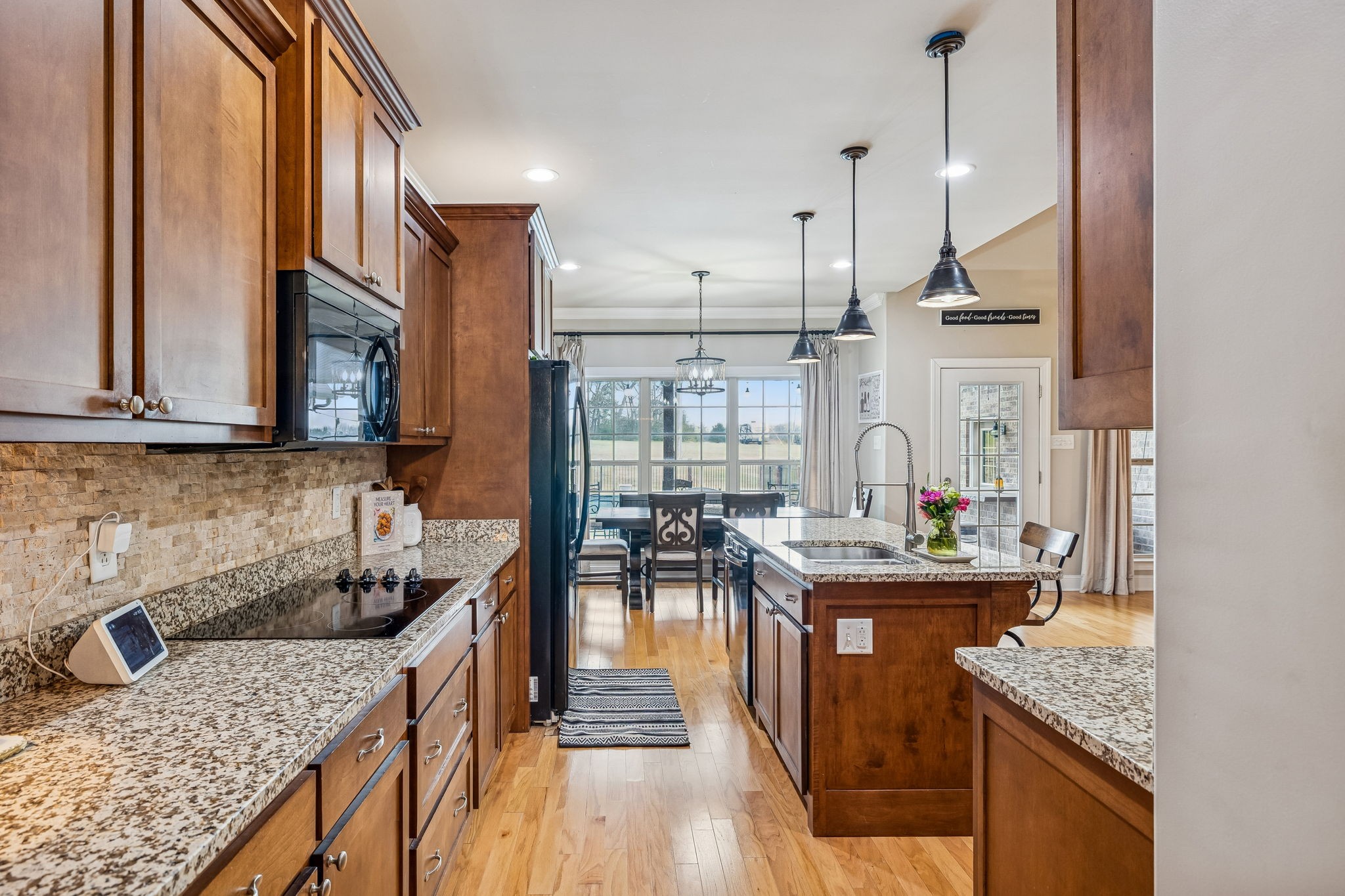 2845 Anes Station Road Lewisburg, TN 37091 - Photo 23 of 70 a kitchen with granite countertop lots of counter top space and wooden floor