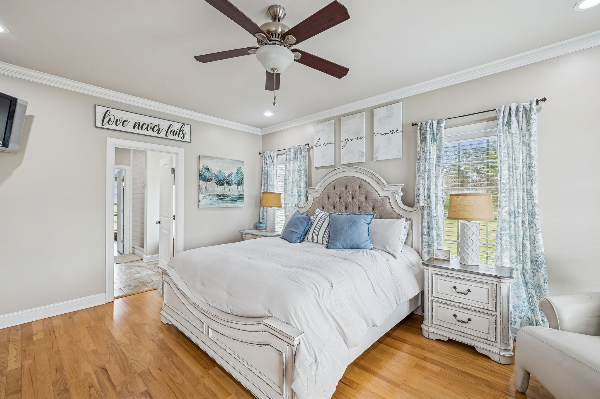 2845 Anes Station Road Lewisburg, TN 37091 - Photo 27 of 70 a bedroom with a large bed and a chandelier