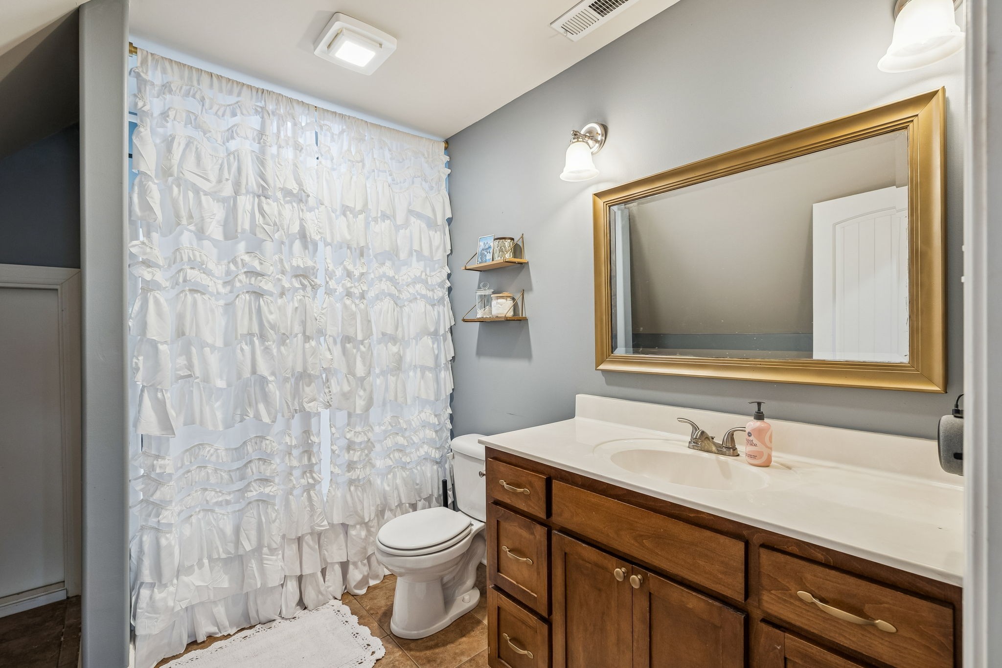 2845 Anes Station Road Lewisburg, TN 37091 - Photo 46 of 70 a bathroom with a granite countertop sink a toilet and a mirror