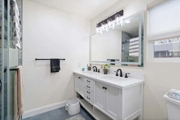 a picture of a bathroom with a shower