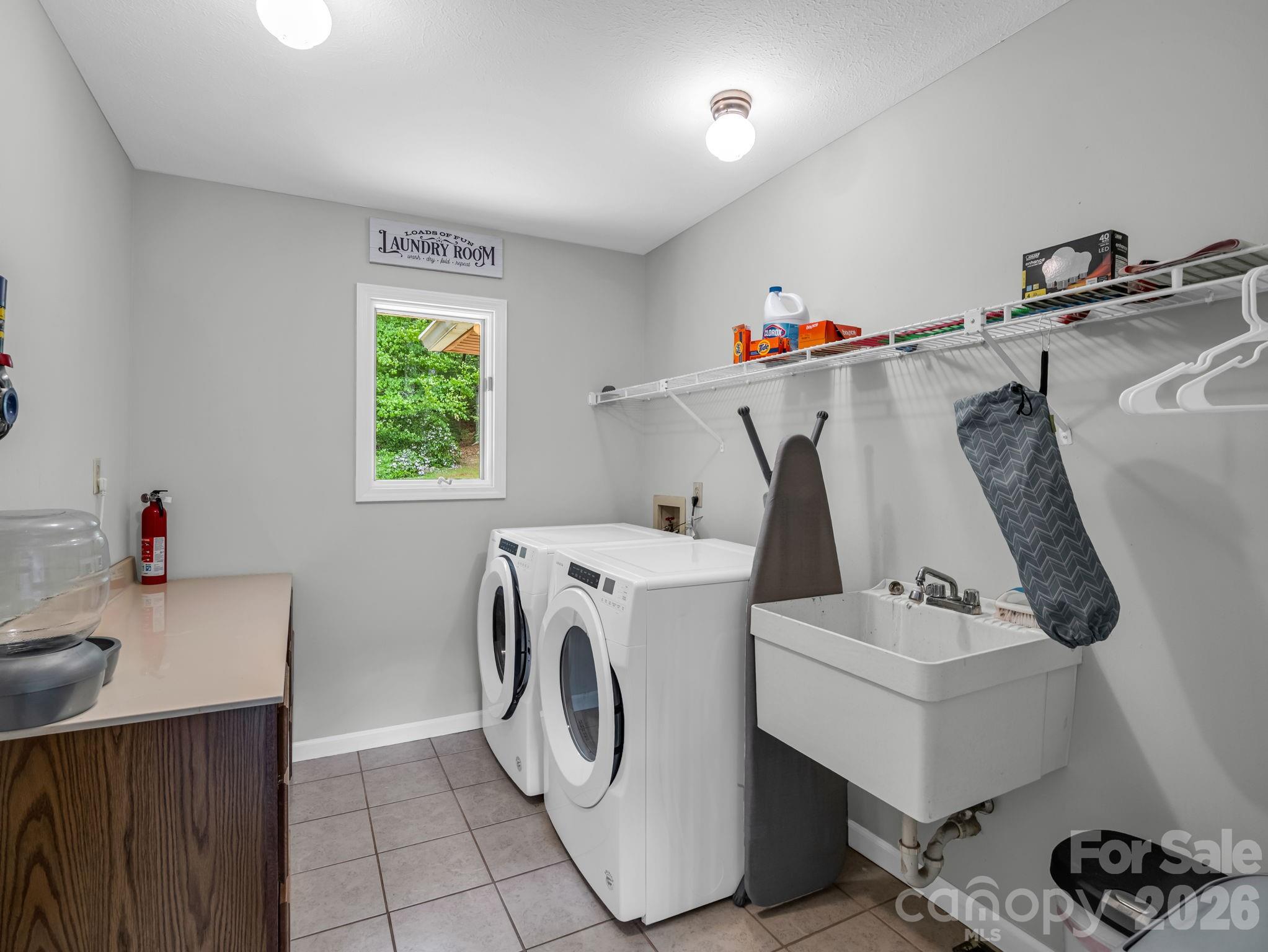 656 Cashiers Valley Road Brevard, NC 28712 - Photo 18 of 37 a utility room with dryer and washer
