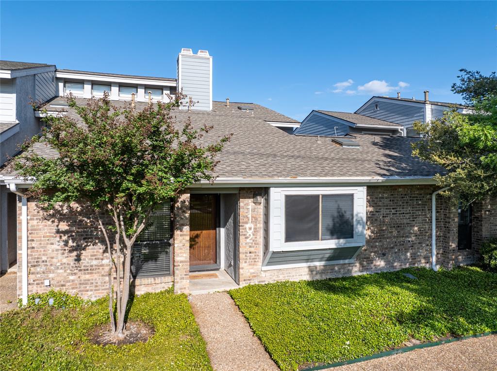 17490 Meandering Way, Unit 1102 Dallas, TX 75252 - Photo 1 of 40 a front view of a house with garden
