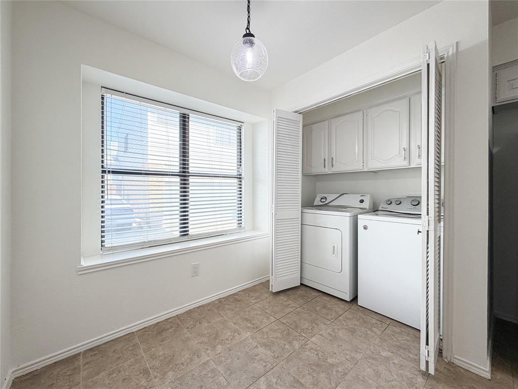 17490 Meandering Way, Unit 1102 Dallas, TX 75252 - Photo 13 of 40 Laundry area featuring full size washer and dryer and cabinet space