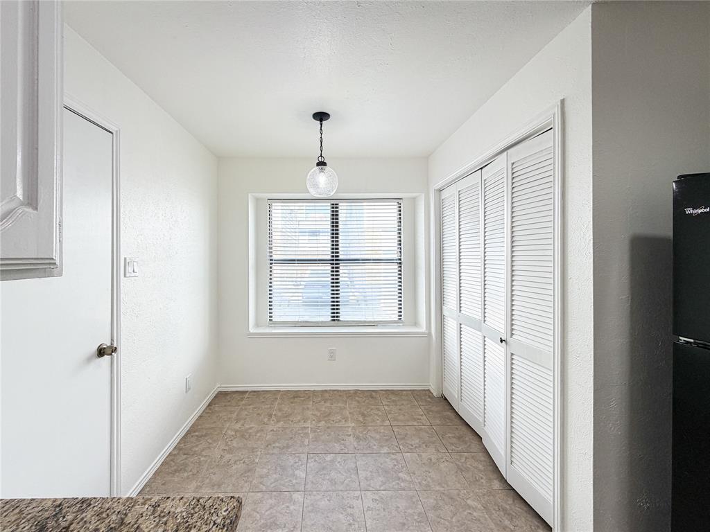 17490 Meandering Way, Unit 1102 Dallas, TX 75252 - Photo 14 of 40 a view of an empty room with a window