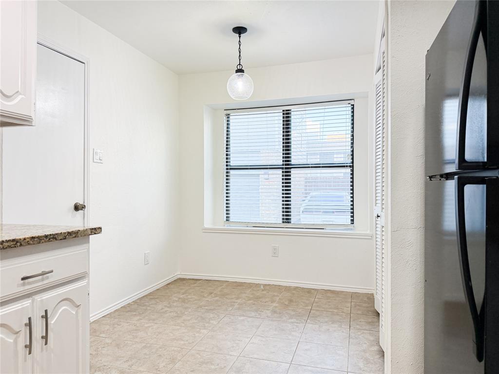 17490 Meandering Way, Unit 1102 Dallas, TX 75252 - Photo 16 of 40 a view of an empty room with a window