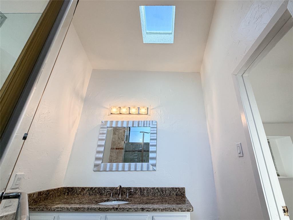 17490 Meandering Way, Unit 1102 Dallas, TX 75252 - Photo 22 of 40 a view of a hallway with wooden floor and a fireplace