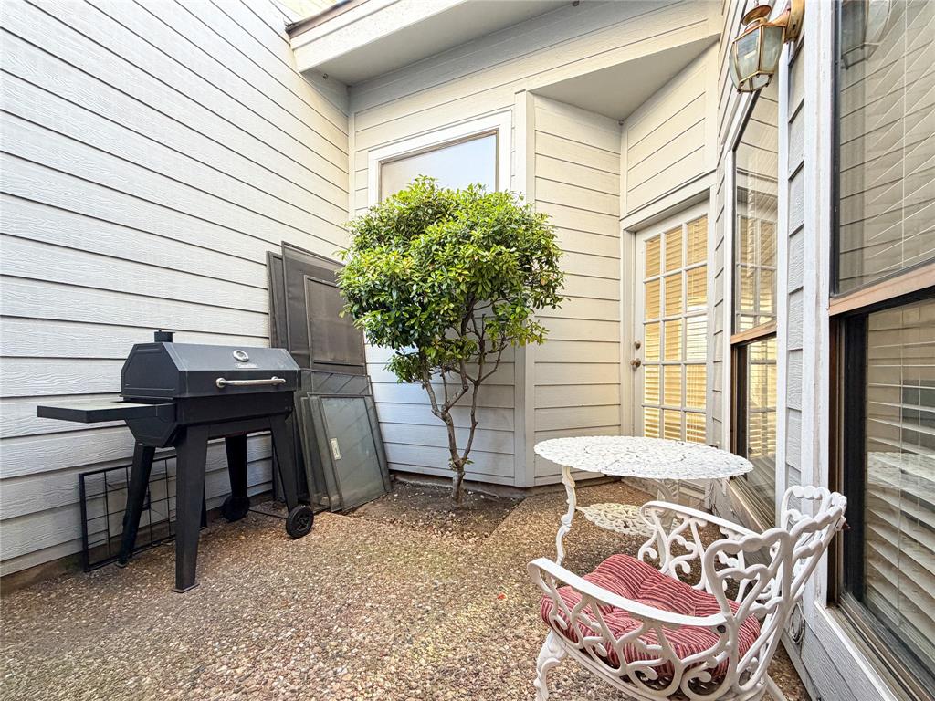 17490 Meandering Way, Unit 1102 Dallas, TX 75252 - Photo 29 of 40 a view of a chairs and tables in the patio