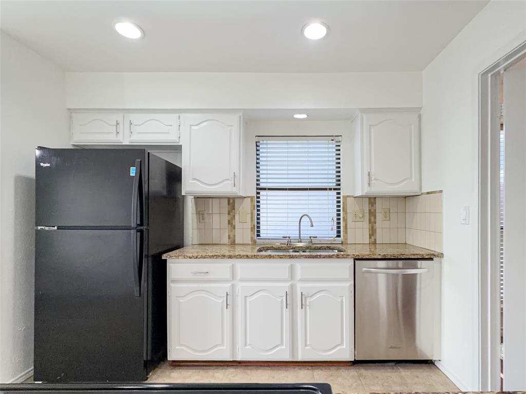 17490 Meandering Way, Unit 1102 Dallas, TX 75252 - Photo 9 of 40 a white refrigerator freezer sitting inside of a kitchen