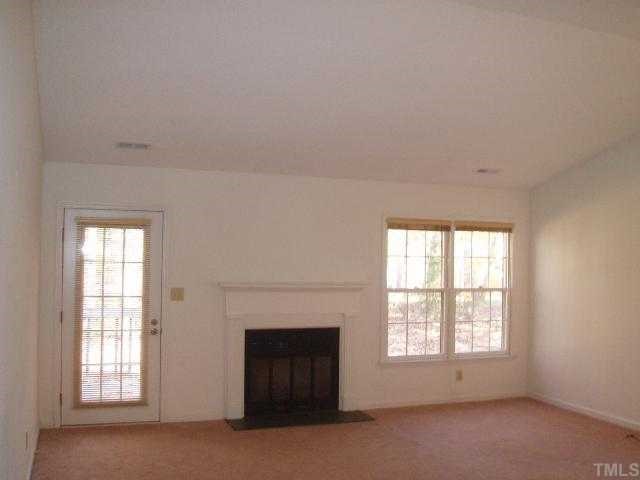 100 Galloway Court Raleigh, NC 27615 - Photo 12 of 12 Neutral carpet and walls throughout the home....; spacious floor plan with cathedral ceiling....combination living room/dining room (20x18); original owner has replaced all mechanicals......new roof 2002. Wood burning fireplace......
