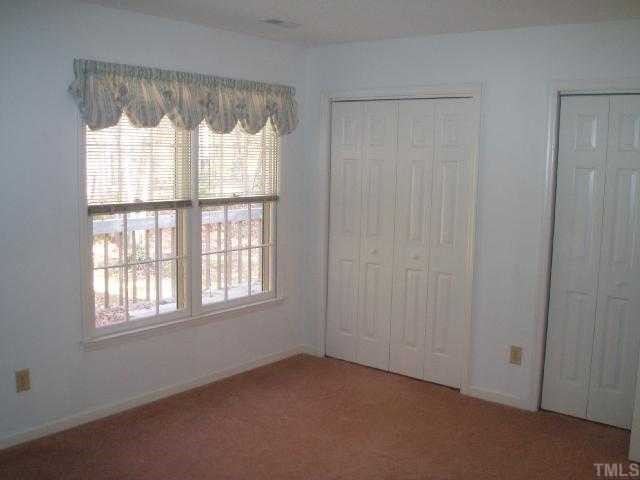 100 Galloway Court Raleigh, NC 27615 - Photo 7 of 12 15x11.3 spacious master suite (carpet is neutral tan tone ((not true color here)). Double closets. Home has pull-down attic stairs for extra storage.