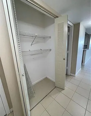 a view of an empty walk in closet