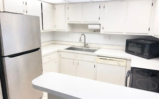 a view of a room with a large window