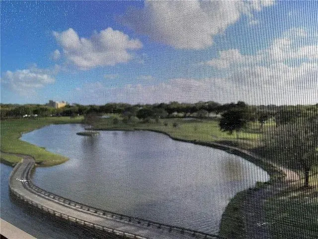 a view of a lake in middle of the house
