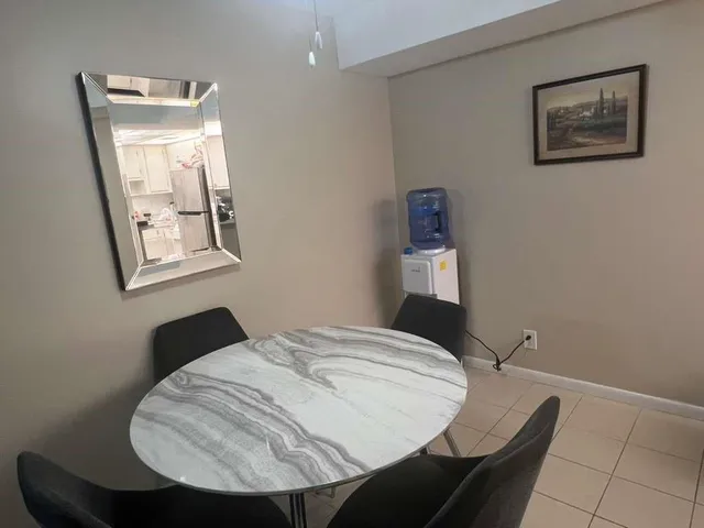 a bedroom with a bed and a mirror